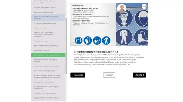 Aufnahme aus der Allgemeinen Sicherheitsunterweisung: Referent erklärt neben der Lerntafel